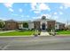 Beautiful single-story home with a stone and white facade, lush green lawn, and well-manicured landscaping at 7482 S Mccormick Way, Queen Creek, AZ 85142