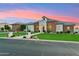 Well-kept single-story home featuring a lush lawn and stylish stone design at 7482 S Mccormick Way, Queen Creek, AZ 85142