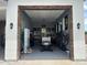 Spacious three car garage including golf cart, tool bench, and bike rack at 7482 S Mccormick Way, Queen Creek, AZ 85142