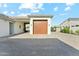 Detached one car garage with a tile roof and matching pavers at 7482 S Mccormick Way, Queen Creek, AZ 85142