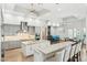 Bright, open kitchen with stainless appliances, a large island, breakfast bar, and adjacent dining area at 7482 S Mccormick Way, Queen Creek, AZ 85142