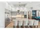 Modern kitchen with gray cabinetry, granite countertops, stainless steel appliances, and a center island with seating at 7482 S Mccormick Way, Queen Creek, AZ 85142