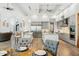 Open-concept kitchen featuring a large island, stainless steel appliances, and gray cabinetry at 7482 S Mccormick Way, Queen Creek, AZ 85142