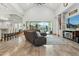 Open living room with high ceilings, tile floors, a large sliding glass door, and contemporary furnishings at 7482 S Mccormick Way, Queen Creek, AZ 85142