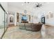 Expansive living room with high ceilings, recessed lighting, tile floors, and ample natural light at 7482 S Mccormick Way, Queen Creek, AZ 85142