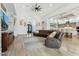 Spacious living room featuring tile floors, high ceilings, modern decor, and open concept design at 7482 S Mccormick Way, Queen Creek, AZ 85142
