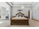 Luxurious main bedroom featuring a seating area and a view of the ensuite bathroom at 7482 S Mccormick Way, Queen Creek, AZ 85142