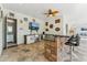An outdoor bar with sleek counter seating, tv, and lighting at 7482 S Mccormick Way, Queen Creek, AZ 85142
