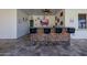 View of the outdoor bar with countertop seating, and a large TV for entertaining at 7482 S Mccormick Way, Queen Creek, AZ 85142