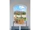 Inviting outdoor seating area offering views of the scenic mountain range through an arched portal at 7482 S Mccormick Way, Queen Creek, AZ 85142
