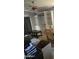 Picture of a living area with built-in shelves and a dark, ornate coffee table, though cluttered with moving items at 7771 N 58Th Ln, Glendale, AZ 85301