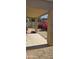 Covered patio overlooking a desert-landscaped yard with pink bougainvillea at 7771 N 58Th Ln, Glendale, AZ 85301