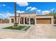 Charming single-story home featuring a stucco exterior, arched entry, and a well-maintained front yard at 858 W Knowles Cir, Mesa, AZ 85210