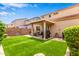 Enjoy the outdoors with a covered patio and artificial turf, perfect for entertaining at 8788 W Wood Dr, Peoria, AZ 85381