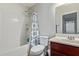 Bathroom features a shower and tub combination with blue patterned shower curtain at 8788 W Wood Dr, Peoria, AZ 85381