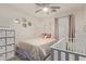 This cozy bedroom is adorned with unique circular mirrors and soothing pink curtains at 8788 W Wood Dr, Peoria, AZ 85381