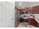 Well-equipped kitchen with stainless steel appliances and ample cabinet space for storage at 8788 W Wood Dr, Peoria, AZ 85381