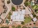 Expansive home in a cul-de-sac, featuring a pool, a putting green, and meticulously landscaped grounds at 9435 E Hobart Cir, Mesa, AZ 85207