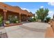 Spacious backyard with a large patio, lush landscaping, and outdoor seating areas, perfect for relaxation at 9435 E Hobart Cir, Mesa, AZ 85207