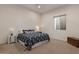Cozy bedroom with patterned bedspread, bedside tables, and ample natural light at 9435 E Hobart Cir, Mesa, AZ 85207