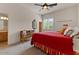 Bright bedroom featuring colorful accents, carpet flooring, and a ceiling fan at 9435 E Hobart Cir, Mesa, AZ 85207