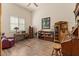 Relaxing bedroom with natural light, hardwood floors, neutral walls, and comfortable furniture at 9435 E Hobart Cir, Mesa, AZ 85207