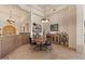 Spacious dining room with neutral walls, carpeted floors, stylish decor, and comfortable seating at 9435 E Hobart Cir, Mesa, AZ 85207