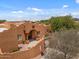 Aerial view of home featuring a grand entrance and Southwest architecture at 9435 E Hobart Cir, Mesa, AZ 85207