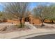 Charming home with desert landscaping and a welcoming entryway at 9435 E Hobart Cir, Mesa, AZ 85207
