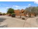 Southwestern home featuring desert landscaping and a circular driveway at 9435 E Hobart Cir, Mesa, AZ 85207