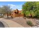 Well-maintained home featuring desert landscaping and Southwest architecture at 9435 E Hobart Cir, Mesa, AZ 85207