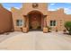 Inviting front entrance with beautiful columns and desert landscaping at 9435 E Hobart Cir, Mesa, AZ 85207