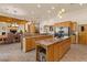 Spacious kitchen with double islands, rich cabinetry, stone counters, and stainless appliances for the serious chef at 9435 E Hobart Cir, Mesa, AZ 85207
