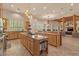A spacious kitchen with dual islands, recessed lighting, and high ceilings gives a great space for gatherings at 9435 E Hobart Cir, Mesa, AZ 85207