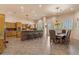 Well-appointed kitchen featuring modern appliances, tiled floors, ample cabinet space, and a cozy dining area at 9435 E Hobart Cir, Mesa, AZ 85207