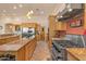 Gourmet kitchen with granite counters, stainless steel appliances, and rich wood cabinetry for the home chef at 9435 E Hobart Cir, Mesa, AZ 85207