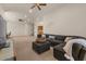 Spacious living room with plush sectional couch and neutral carpet at 9435 E Hobart Cir, Mesa, AZ 85207
