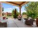 Inviting covered patio features comfortable seating and views of the landscaped yard at 9435 E Hobart Cir, Mesa, AZ 85207