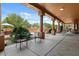 Spacious covered patio with outdoor seating, ideal for entertaining guests at 9435 E Hobart Cir, Mesa, AZ 85207