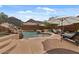 Beautiful backyard pool with rock features, a waterfall, and plenty of space for relaxing and entertaining at 9435 E Hobart Cir, Mesa, AZ 85207