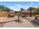 Stunning backyard oasis featuring a sparkling pool with a rock waterfall and luxurious lounge chairs at 9435 E Hobart Cir, Mesa, AZ 85207