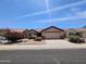 Charming single-story home with a two-car garage and low-maintenance desert landscaping at 9983 W Monterosa Ave, Phoenix, AZ 85037