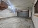 Spacious and unfinished two-car garage offering ample storage and parking space at 9983 W Monterosa Ave, Phoenix, AZ 85037