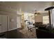 Open-concept living room flows to dining and kitchen areas at 9983 W Monterosa Ave, Phoenix, AZ 85037