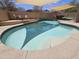 Inviting pool features tiled steps and is surrounded by a concrete patio and artificial turf at 9983 W Monterosa Ave, Phoenix, AZ 85037