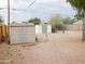 Spacious backyard with metal and vinyl sheds provides ample storage space at 1019 E Granada Ave, Apache Junction, AZ 85119