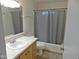 Standard bathroom with vanity, toilet, and tub/shower combination featuring neutral color palette at 1019 E Granada Ave, Apache Junction, AZ 85119