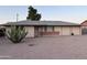 Charming single story home featuring a two car garage and desert landscaping at 1019 E Granada Ave, Apache Junction, AZ 85119