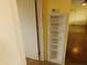 Hallway with a built-in shelving unit and doorway to the next room at 1019 E Granada Ave, Apache Junction, AZ 85119