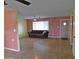 Open living room featuring a ceiling fan and plentiful natural light at 1019 E Granada Ave, Apache Junction, AZ 85119
